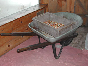 large sifter on wheelbarrow