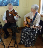 Steve & Sue playing at Village Artisans Art Auction